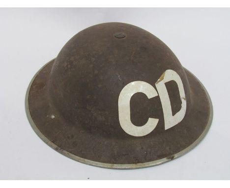 A WWII Brodie helmet with CD (Civil Defence) decal, liner and chinstrap 