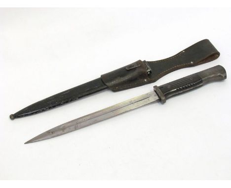 A WWII era German Alcoso Solingen K98 Mauser bayonet with Bakelite grips and black-painted steel scabbard. Numbered 0655 to b