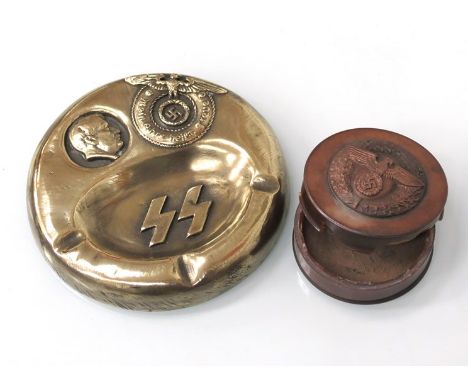 A brass ashtray bearing SS emblem and Hitler side portrait, together with a reproduction snuff box a/f (2)