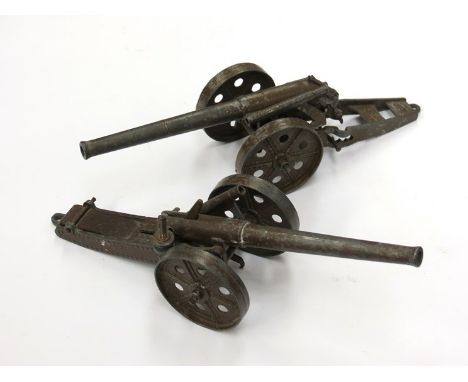 Two small model metallic cannons