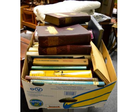 Two quilts together with a box of books relating to textiles and craft