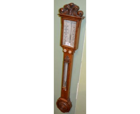 An oak stick barometer, signed J White, Glasgow, circa 1850, carved pediment, concealed mercury tube with a twin ivory vernie