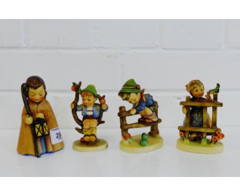 A collection of four Hummel figures to include 'Apple Tree Boy', 'Retreat to Safety' and two others, (4) 