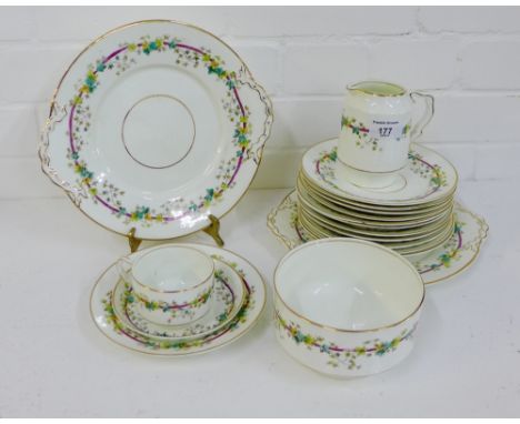 A late 19th century white glazed teaset with garland of ivy leaf and foliage pattern comprising twelve cups, twelve saucers, 