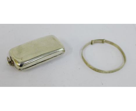 An Edwardian silver Sovereign case, Birmingham 1909 together with a child's Sterling silver bangle (2) 