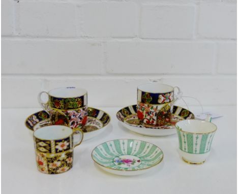 A pair of Royal Crown Derby 'Imari' patterned cups and saucers, together with an 'Imari' patterned 2451 coffee can and a Crow