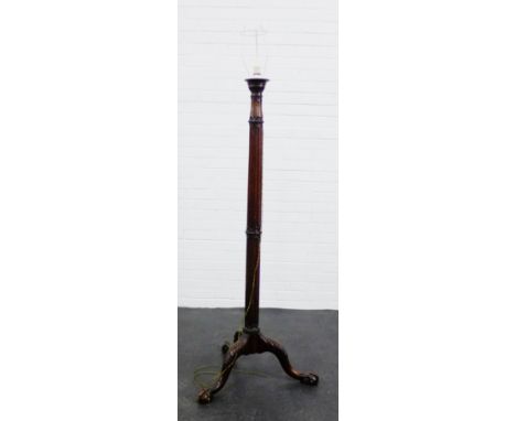 A mahogany carved standard lamp