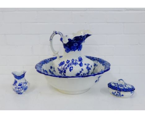 A Doulton Burslem blue and white 'Buttercup' patterned toilet set, comprising basin and ewer, toothbrush holder and soap dish