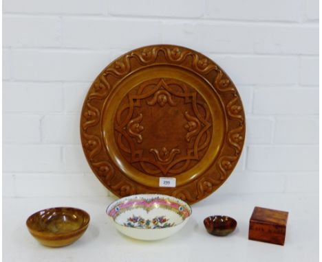 A mixed lot to include a circular olive wood type carved wooden plaque, two small wooden bowls, a burr wood box and an Austri