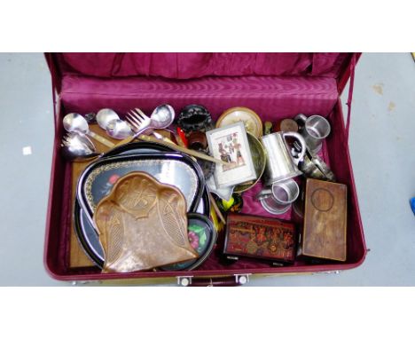 A vintage suitcase containing copper crumb tray, leather gloves, tea caddy etc., (a lot) 