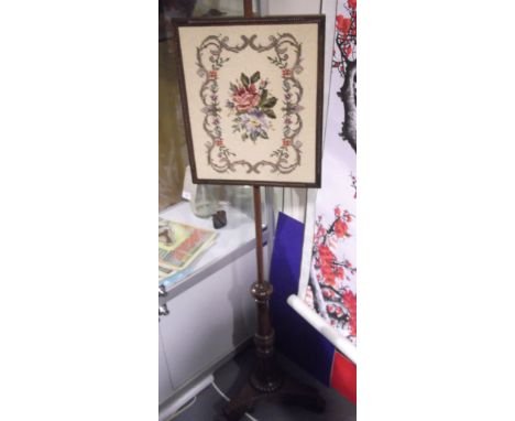 A William IV simulated rosewood polescreen with rectangular floral tapestry banner on turned fluted pillar, triangular platfo