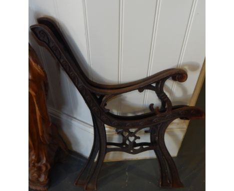 A pair of Victorian style cast metal garden bench end sections.