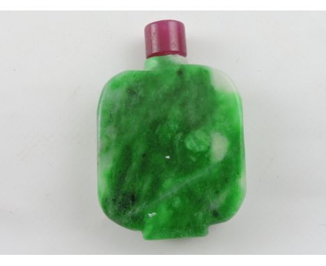 A Chinese rectangular green hardstone (possibly jade) scent bottle with stopper. 