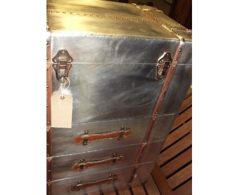 An Aviator style three-drawer trunk, the hinged top with leather corners and wooden laths above frieze drawers, W. 61cm.