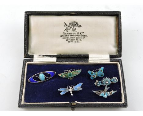 A silver enamel brooch by Charles Horner, in the form of an insect with turquoise wings, together with five other similar bro