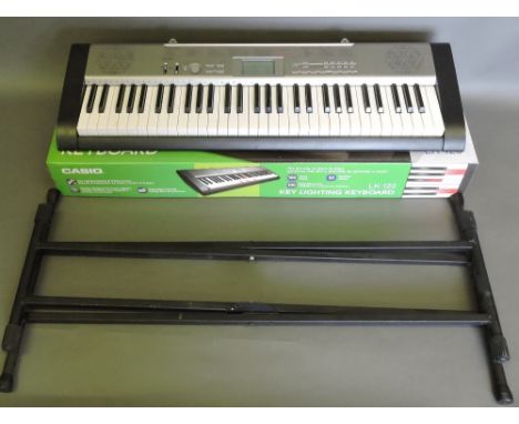 Casio KL-120 key lighting keyboard, boxed, with X-frame stand.