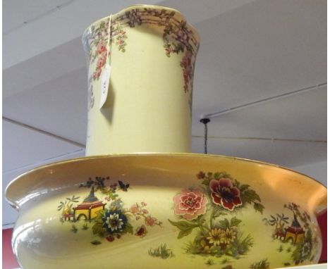 An early 20th Century Staffordshire pottery wash jug and a basin.