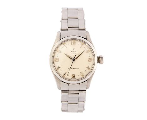 Tudor Rolex, a late 1950's Tudor Oyster Shock Resisting steel wristwatch, 3cm circular champagne dial with dagger hands, coro
