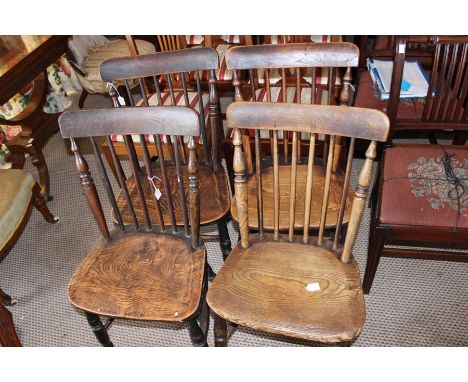 A set of five mid 19th Century elm and ash stick back chairs, with solid seats (5)