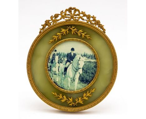 An Edwardian gilt metal circular easel photograph frame, inset green onyx surround, height 19cm, opening diameter 9cm