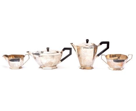 An Art Deco silver four piece teaservice comprising teapot, hotwater jug, milk jug and sugar bowl, plain octagonal bodies on 