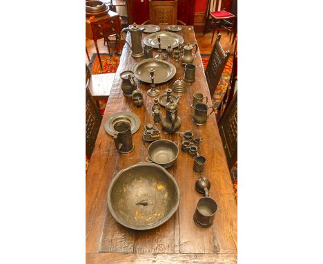 A large quantity of pewter including chargers, tankards, measures, bowls etc. James Dixon. All items on table. (36)