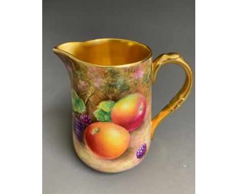 A Royal Worcester water jug, painted with fruit and gilded inside, signed Leaman, 20th Century black mark England, 10cm highC