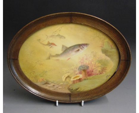 An English porcelain oval plaque painted with fish, seaweed and anemones, mounted in an oval wooden frame, signed James Edwar