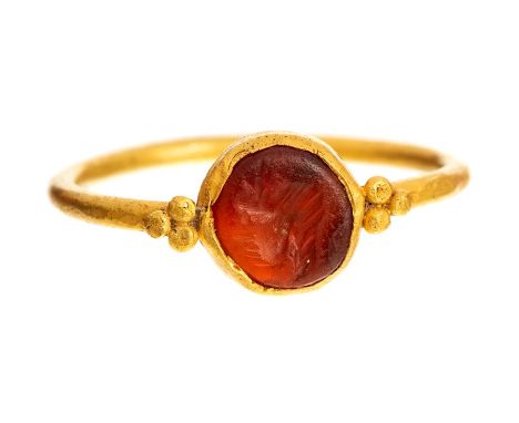 Roman (2nd - 3rd century AD) oval bezel set with a carnelian intaglio engraved with faint portrait, on a later shank, ring si