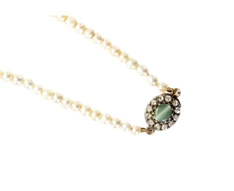 A Victorian single row pearl necklace with chrysoberyl and diamond clasp, the single graduated row of pearls assessed as natu