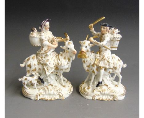 A pair of Derby white and gilt Welch Tailor and Wife on goats, circa 1825, painted red mark and Derbyincised N62, 14.5cm high