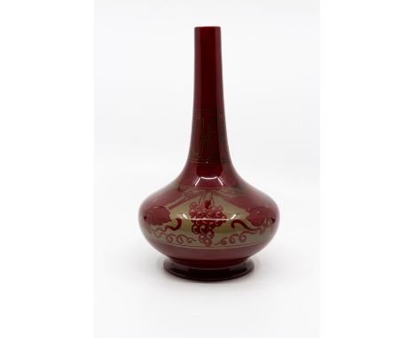 Bernard Moore - A early 20th Century flambé vase of squat globe and shaft form decorated with a grapevine pattern on a gradua