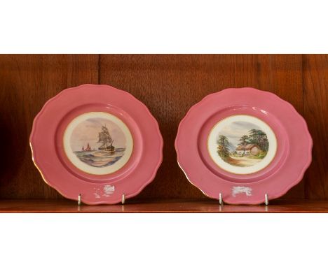 W.E.J. Dean for Royal Crown Derby, two scene painted plates, within pink borders, including cottage scene and marine scape, 2