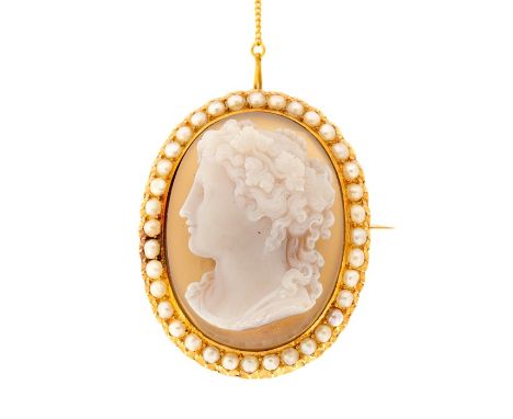 A 19th Century oval hardstone cameo brooch, the finely carved bust profile of classical goddess with light brown reverse, the