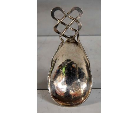 A Keswick School of Industrial Art silver Arts &amp; Crafts caddy spoon, the oval&nbsp;planished bowl with&nbsp;open work Cel