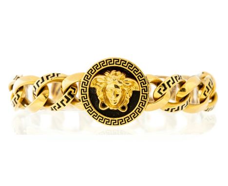 18ct gold and black enamelled Medusa bracelet, the round central panel clasp with applied Medusa head to centre, black enamel