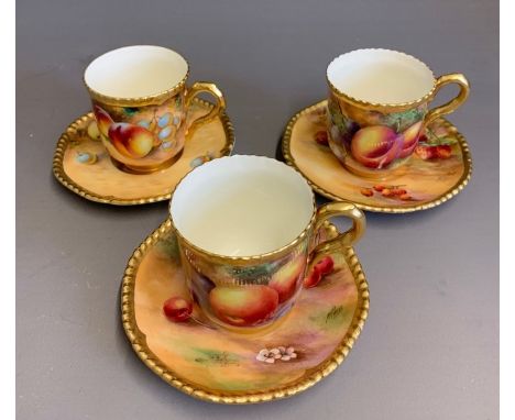 Three Royal Worcester coffee cups and saucers with gilded rope rims, two saucers and one cup signed Price, one cup and one sa