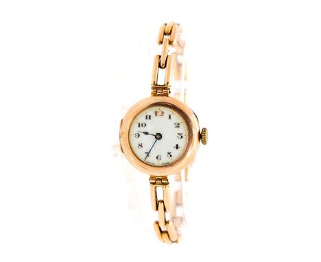 A circa 1920's lady's 9ct rose gold wristwatch, 2.5cm circular enamel dial, integral expanding strapCondition: light wear, mo