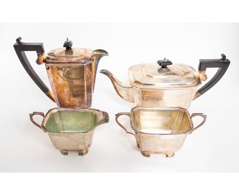 An Art Deco style silver four piece tea set including teapot, hot water jug, cream jug and sugar basin, of angled cuboid form