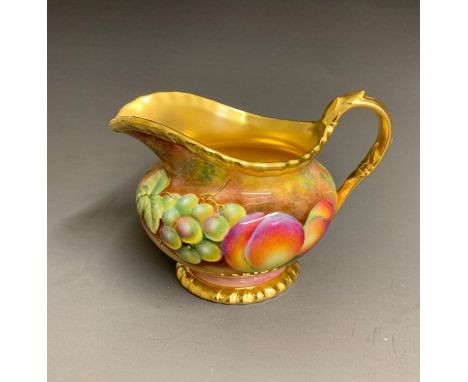 A Royal Worcester milk jug painted with fruit and gilded inside, signed Leaman, 20th Century black mark England, 9.5cm highCo