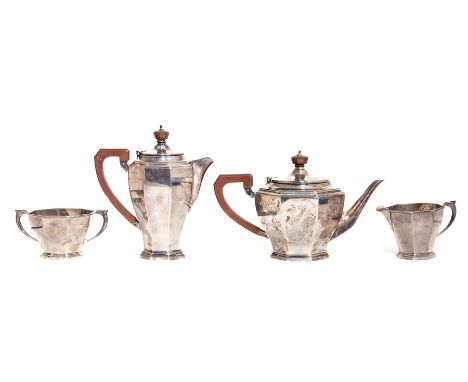 An Art Deco silver four piece tea service including teapot, hot water jug, sugar bowl and milk jug, plain octagonal bodies on