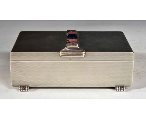 Art Deco style silver mounted cigarette box, engine turned decoration, the cover with graduating thumbpiece and set with thre