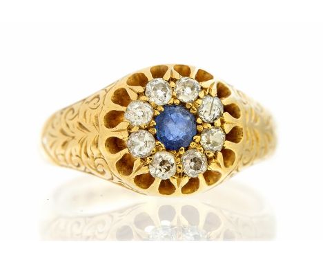 An Edwardian 18ct gold sapphire and diamond round cluster signet style ring, scroll decorated shoulders claw settings, Cheste