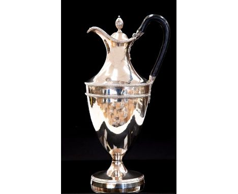 A George IIII Neo-Classical silver claret jug, urn shaped plain body with beaded borders on rim, central section and foot, en