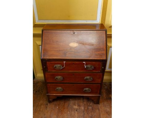 An Edwardian mahogany bureau, the fall front enclosing a fitted interior, inlaid paterae design to fall front, three drawers 