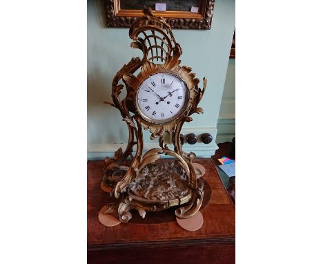 A French Henri Leroy et Fils 19thC Rococo revival brass cased 8 day mantle clock, white porcelain dial, black Roman numerals,