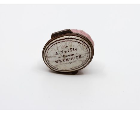An 18th Century Bilston enamel oval patch box, circa 1780, the cover with motto 'A Trifle from Weymouth', mirrored inner cove