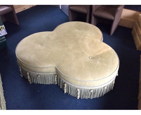 A contemporary upholstered pouffe.