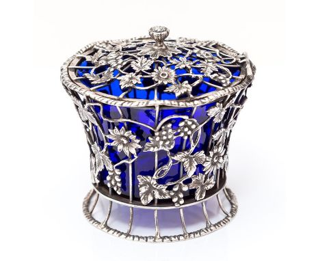 An Edwardian silver pot and cover, tapering cylindrical body with wirework flower heads, leaves and vines overlaid, the hinge