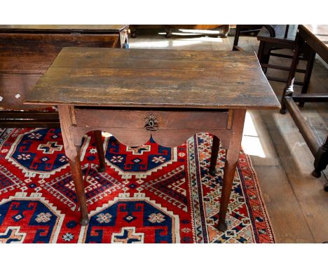 A William and Mary period oak side table, fitted with&nbsp;a single drawer, the front and sides with a shaped&nbsp;apron, sta